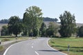 curvy rural avenue in the Eifel during late summer Royalty Free Stock Photo