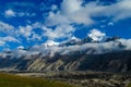 Tian Shan mountains snow peaks and clouds panorama Royalty Free Stock Photo