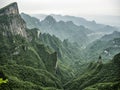 Tianmen Mountain Known as The Heaven`s Gate surrounded by the green forest and mist at Zhangjiagie, Hunan Province, China, Asia Royalty Free Stock Photo