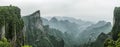 Tianmen Mountain Known as The Heaven`s Gate surrounded by the green forest and mist at Zhangjiagie, Hunan Province, China, Asia