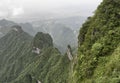 Tianmen Mountain Known as The Heaven`s Gate surrounded by the green forest and mist at Zhangjiagie, Hunan Province, China, Asia Royalty Free Stock Photo