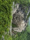 The Tianmen Mountain with a view of the cave Known as The Heaven`s Gate surrounded by the green forest and mist at Zhangjiagie, H Royalty Free Stock Photo