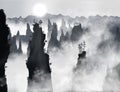 Tianzi Mountains or Avatar Mountains in the Zhangjiajie Forest Park covered with fog with sun shining through it.. Hunan