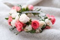 Tiara of artificial roses on wooden background.