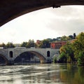 Tiber river and a PASA bridge in Rome. Aged photo.