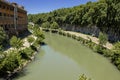 The Tiber River runs through the city of Rome. The waterfalls of the river refresh the seagulls.