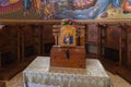 The table with donation box in the main hall of the Church of the Apostles located on the shores of the Sea of Galilee, not far