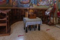 The table with donation box in the main hall of the Church of the Apostles located on the shores of the Sea of Galilee, not far