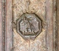 Bas-relief with scenes from the Bible on the massive decorated front door at the entrance to Tabgha - Catholic Church Multiplicat