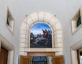 A drawing on the wall with a plot, as Jesus preaches to people over the entrance to the Beatitude Monastery located on the mounta