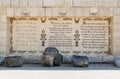 The lines from the Gospel of Mark in Arabic, Russian and German languages written on the wall in the Baptist place Yardenit, where