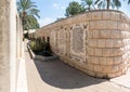 The lines from the Gospel of Mark in several languages written on the wall in the Baptist place Yardenit, where the rites of bapti