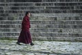 Tibetan monk walking in Drepung Monastery. It is the largest of all Tibetan monasteries and is located on the Gambo Utse mountain,