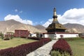 Devotee walk around black stupa in Samye monastery