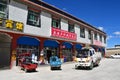 Tibet, China, June, 20, 2018.  Transport parked in front of shops in small town on the way from Darchen to Shigatse Royalty Free Stock Photo