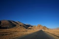 Tibet, snow-capped mountains under the dirt road, the car background Royalty Free Stock Photo