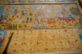 Tibetan art murals on building wall in Dayan old town. Royalty Free Stock Photo