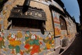 Tibetan art murals on building wall in Dayan old town. Royalty Free Stock Photo