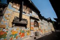 Tibetan art murals on building wall in Dayan old town. Royalty Free Stock Photo