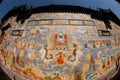 Tibetan art murals on building wall in Dayan old town. Royalty Free Stock Photo