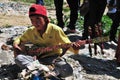 Tibetan boy playing the instrument Royalty Free Stock Photo