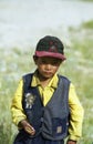 Tibetan boy with yellow shirt and cap Royalty Free Stock Photo