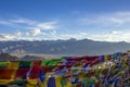 Tibetan Buddhist colored prayer flags on the background of a mountain desert Royalty Free Stock Photo