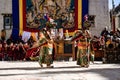 Tibetan Buddhist dancers in traditional demon spirit ghost clothing doing the ritual dance