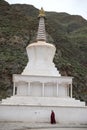 Monk walking around stupa Royalty Free Stock Photo
