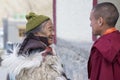 Tibetan Buddhist old woman and monk in the monastery of Lamayuru, Ladakh, India