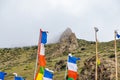 Tibetan Buddhist Prayer Flags on a Green Mountain Hilltop in Kagbeni of Upper Mustang, Nepal Royalty Free Stock Photo