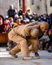 Tibetan Buddhist ritual fool dancers at the Tiji festival in Nepal, in a vertical shot