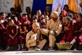 Tibetan Buddhist ritual fool dancers with young monks at the Tiji festival in Nepal