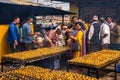 Tibetan Buddhists worshiping with candles at Boudhanath temple complex in Kathmandu Nepal