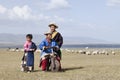 Tibetan children play near Qinghai Lake, China