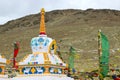 Tibetan colorful stupa surrounded by flags.