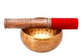 Tibetan copper singing bowl and wooden mallet with red fiber.