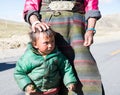 A Tibetan farmer with her kid