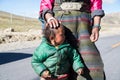 A Tibetan farmer with her kid