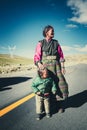 A Tibetan farmer with her kid