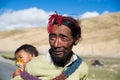 A Tibetan farmer with his kid