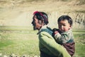 A Tibetan farmer with his kid