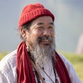 Tibetan Lama conducts classes with sunsurfers people on meditation and yoga near the lake in Pokhara, Nepal