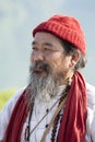 Tibetan Lama conducts classes with sunsurfers people on meditation and yoga near the lake in Pokhara, Nepal