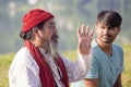 Tibetan Lama conducts classes with sunsurfers people on meditation and yoga near the lake, Pokhara, Nepal