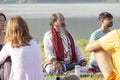 Tibetan Lama conducts classes with sunsurfers people on meditation and yoga near the lake, Pokhara, Nepal