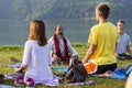 Tibetan Lama conducts classes with sunsurfers people on meditation and yoga. Pokhara, Nepal