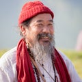 Tibetan Lama conducts classes with sunsurfers people on meditation and yoga. Pokhara, Nepal