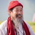 Tibetan Lama conducts classes with sunsurfers people on meditation and yoga. Pokhara, Nepal Royalty Free Stock Photo