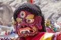 Tibetan man, dressed in a mystical mask, perform a dance during the Buddhist festival in Hemis monastery, Ladakh, India